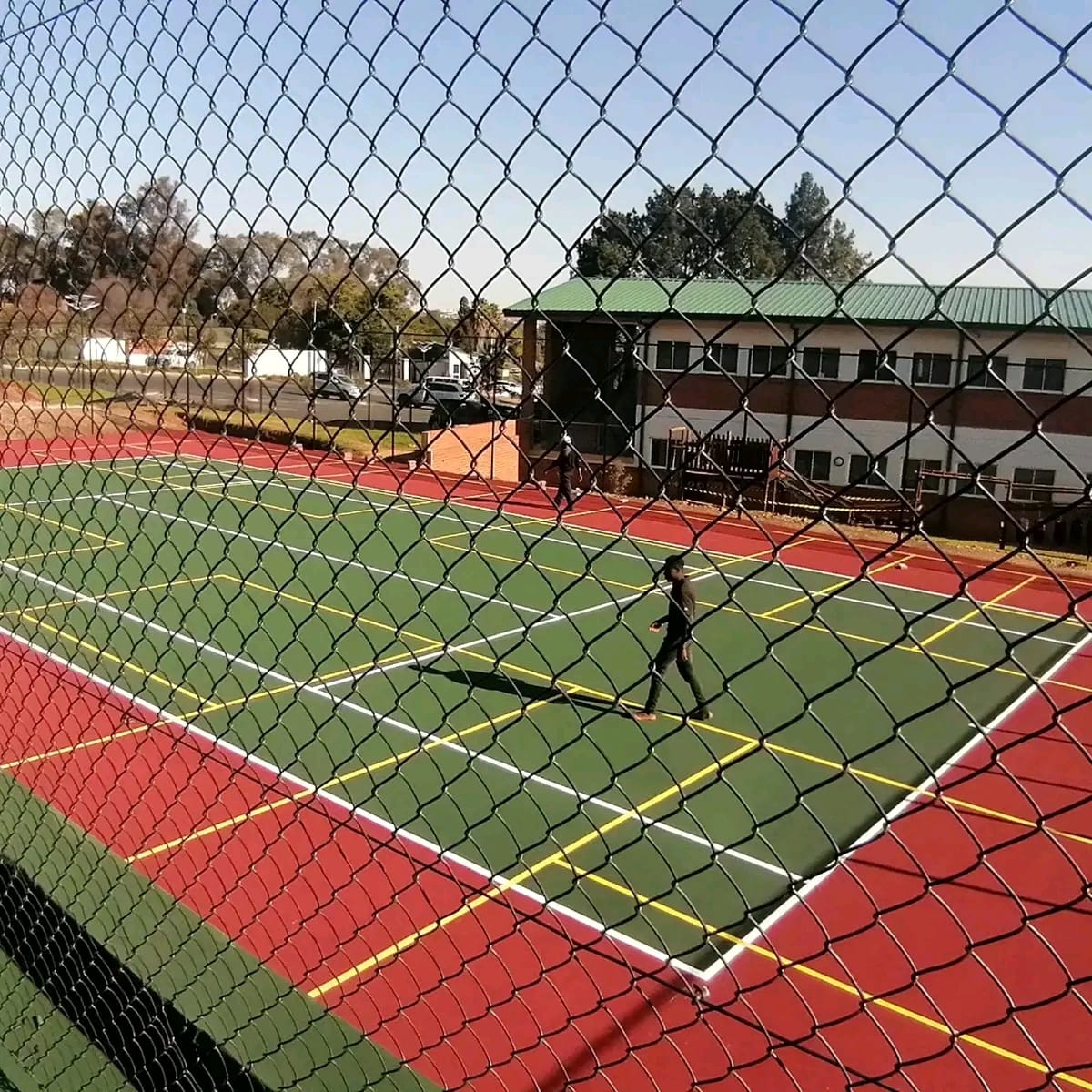 Completed sports court surfacing and fencing project by Modern Projects ZW